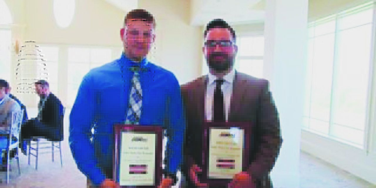 Two honored for work on fallen letter carrier