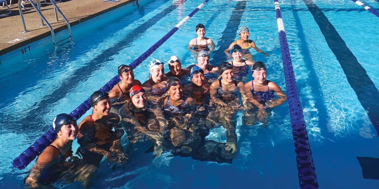 Warrior swimmers improve on times against tough league opponents