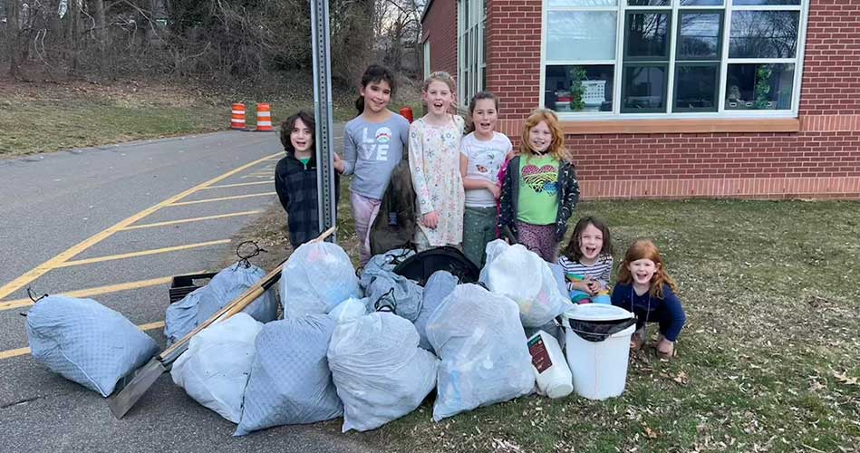 Dolbeare students clean up surrounding wooded areas